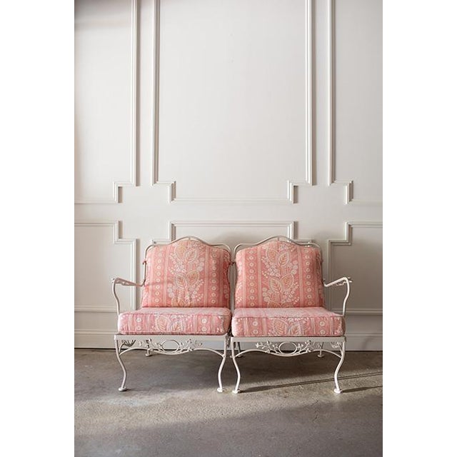 Gorgeous vintage mid-century wrought iron loveseat in immaculate condition. The heavy-duty frame features a beautiful...