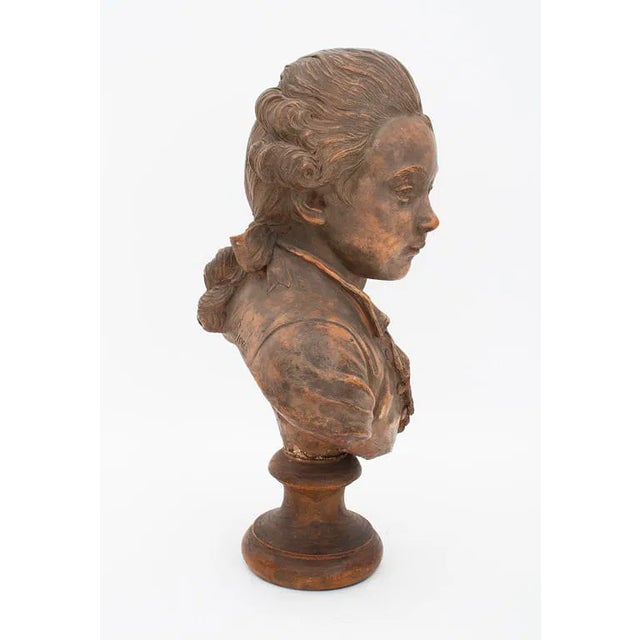 A finely modeled bust in the Neoclassical style, after 18th-century French sculptor Augustin Pajou. This early 20th-...