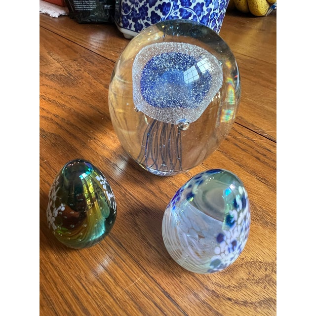 Up for consideration is a beautiful vintage collection of blue glass paperweights. These would look lovely in your home,...
