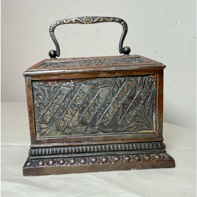 Up for sale is an exceedingly a rare antique late 19th century cast iron State Savings Bank from St. Paul, Minnesota....