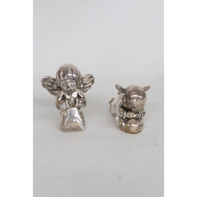 This Pair of Cherubs appear to be silver plated. These darling expressive cherub figurines come together as a miniature 2...