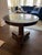 Burled Wood Empire pedestal entry table, black polished Belgium limestone top with column tripod base with bronze accent