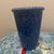 An elegant mid-century modern style ceramic vase featuring a striking, deep cobalt blue spongeware glaze. The vessel...