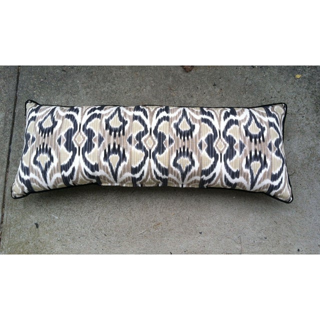 Body pillow, in beautiful ikat fabric in brown , black and beige with black welt and zipper. The front and back are the...