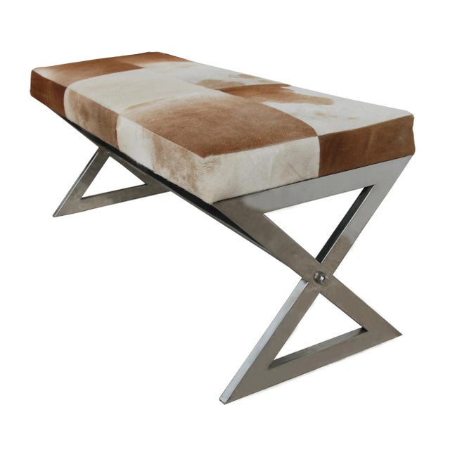 Modern genuine tan cowhide and chrome bench, gently used.