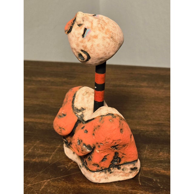 A striking hand‑built ceramic sculpture by contemporary American artist Nancy Kubale, celebrated for her expressive...