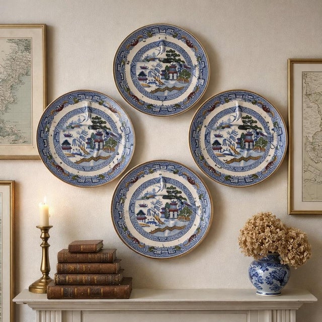 A striking set of five early Victorian Davenport Staffordshire plates decorated in a vibrant chinoiserie landscape with...