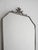 Vintage mirror with trapezoidal tin frame, floral decoration, and original glass with imperfections. Scandinavian-made...