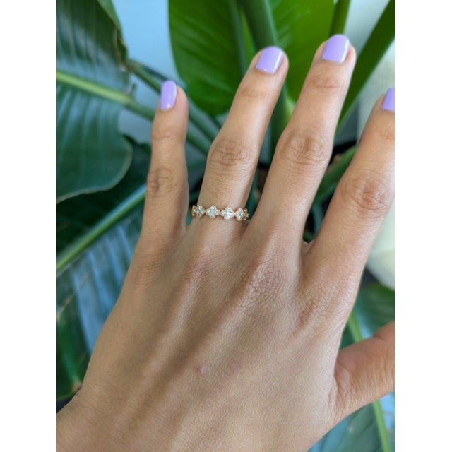 Twenty-five earth-mined diamonds shimmer across this solid 14K rose gold band, totalling 0.35 carats. Substantial and...