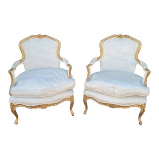 Pair of French 1950s Bergere Gilt Chairs For Sale