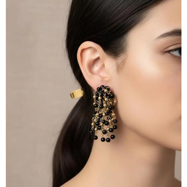 These striking 1980s Italian chandelier earrings perfectly embody the bold, glamorous aesthetic of the decade, combining...
