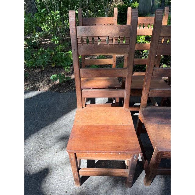 A set of six American, possibly Santa Fe / New Mexico, wood chairs in the Spanish Colonial style, including two armchairs....