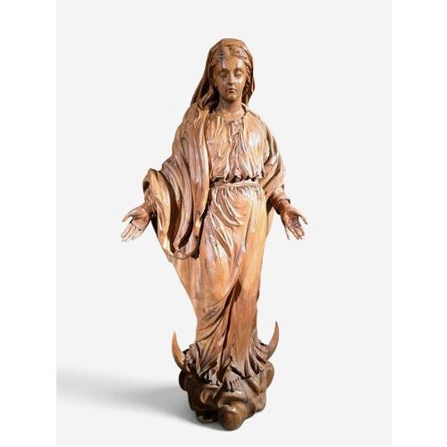 An impressive 17th-century German carved fruitwood figure of the Virgin Mary, remarkable for its large scale, elegant...