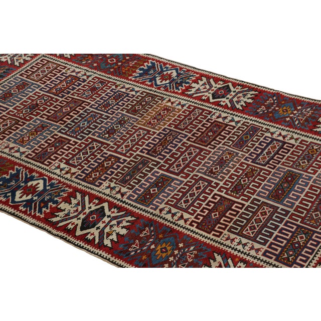 Made with hand-knotted wool in Turkey circa 1950-1950, this 3x6 vintage tribal runner is an exciting new curation from Rug...