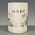 A charming Chinese porcelain brush pot (bitong). The cylindrical vessel features a creamy, all-over crackle glaze and is...