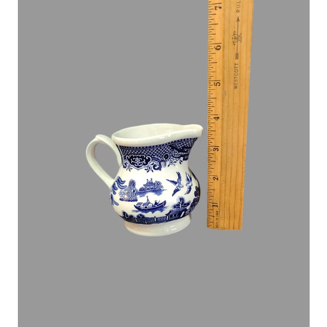 This vintage Churchill creamer is a beautiful piece of blue and white Willow pattern ceramic. Made in Staffordshire,...