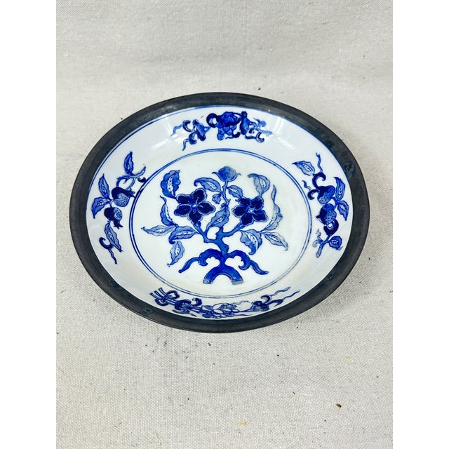 Vintage blue and white hand painted decorative bowl encased in pewter. This is a pre-owned item so please see all pictures...