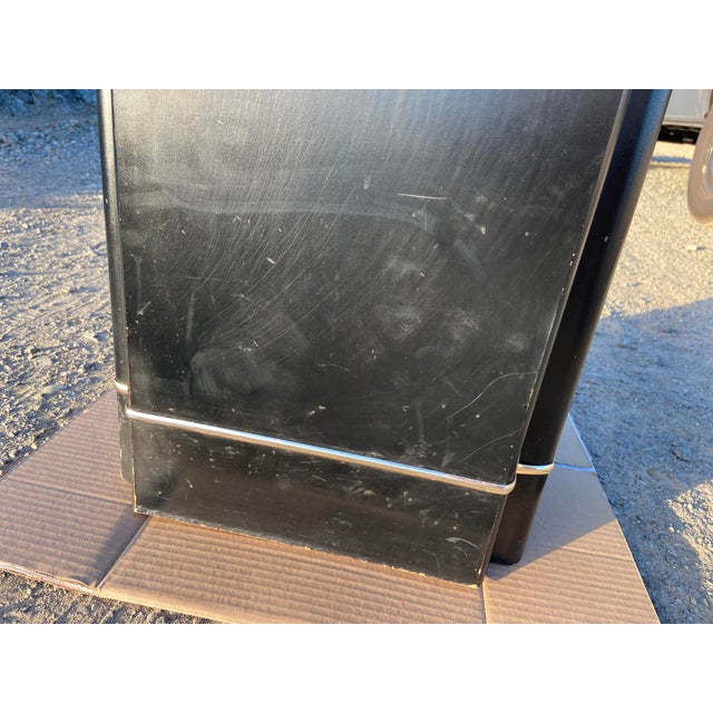 This postmodernist Hollywood regency style side end coffee table features a mirror top and a sleek black lacquered...