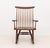 George Nakashima (American, 1905-1990) American Walnut New Rocking Chair, 1962, with spindle back. 35.75" H x 24.5" W x...