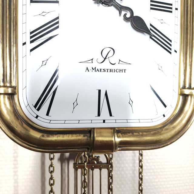 Mid-Century Vintage Dutch Zaanlandse style mechanical wall clock, featuring the signature A. Maestricht dial logo. Built...