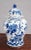 A pair of blue and white lidded temple jars with an overall floral pattern (more dense on the front and open on the...