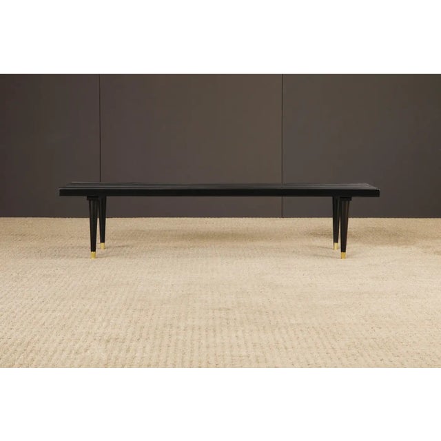 A beautifully refinished Mid-Century Modern slatted wood bench, circa 1960s. Expertly crafted with clean architectural...