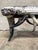 A bold steer horn bench with a speckled cowhide seat — real presence and real materials. The base is built entirely from...