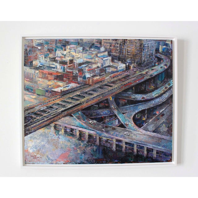 This mixed media piece on wood panel captures a dynamic urban landscape, showcasing an intricate network of highways and...