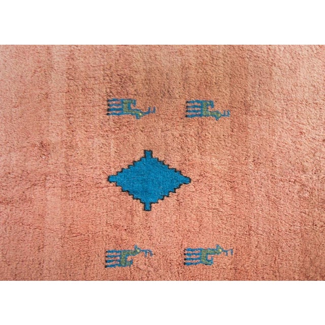 A gorgeous and playful vintage Persian Gabbeh rug with a crimson abrash ombre field with a bright indigo diamond medallion...