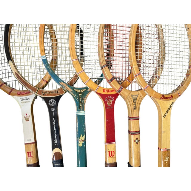 The product is a set of 6 vintage wooden tennis racquets from well-known brands such as Wilson, Bancroft, and Spaulding....