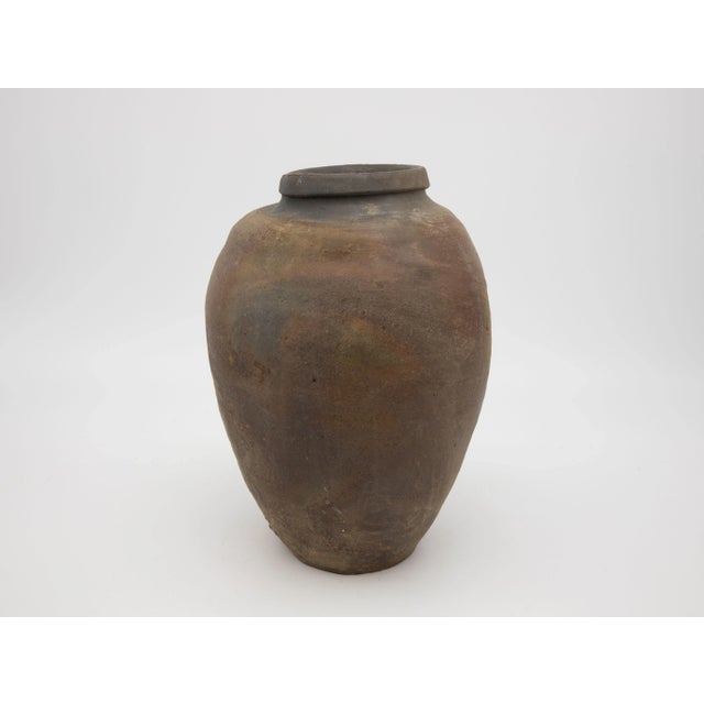 A vintage French earthenware vase with wide open mouth. Wear consistent with age and use.