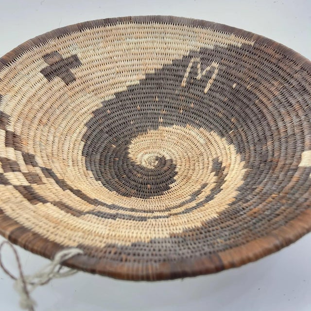 This handwoven basket from Botswana reflects a long-standing tradition of fiber artistry shared across southern Africa,...