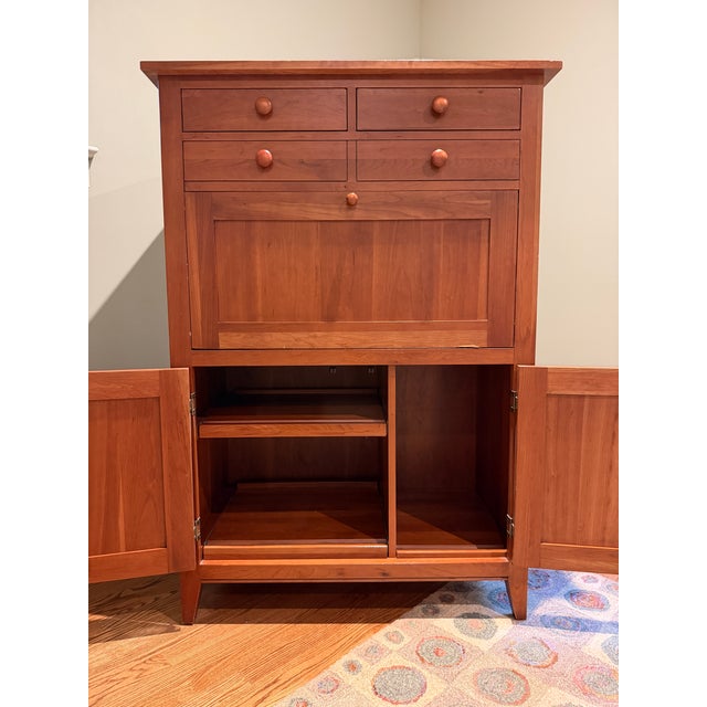 Ethan Allen New Impressions Secretary Desk in Natural Cherry finish (234), made in the USA. Its compact closed footprint...