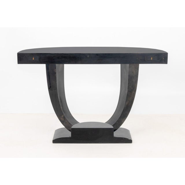 Karl Springer Goatskin Lacquered Console Table, in black with geometric base. 34" H x 54" W x 18" D. Provenance: From a...