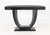 Karl Springer Goatskin Lacquered Console Table, in black with geometric base. 34" H x 54" W x 18" D. Provenance: From a...