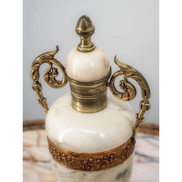 Heavy marble vases with gilded bronze decorations in the Louis XVI style. Condition: very good without damage. Date:...