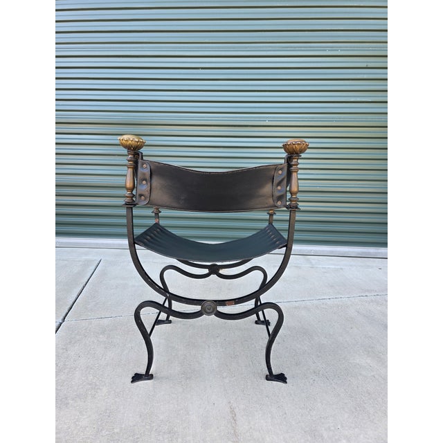 From our family estate. Mid 20th century hand-wrought iron and brass Savonarola Curule chair made in Italy. Classic form...