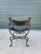 From our family estate. Mid 20th century hand-wrought iron and brass Savonarola Curule chair made in Italy. Classic form...