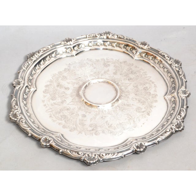 A charming marked Gorham round salver or serving or drinks tray of fine plate silver, in the Chippendale style, featuring...