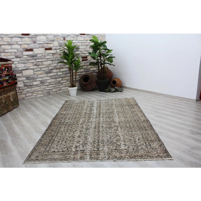 This gorgeous hand knotted Vintage Anatolian area rug is approximately 60 years old in excellent vintage condition. The...