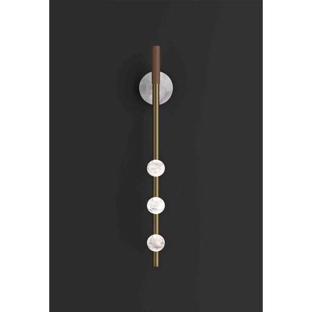 Demetra bronze wall lamp by alabastro italiano dimensions: d 9 x w 10 x h 60 cm. Materials: white alabaster, bronze and...