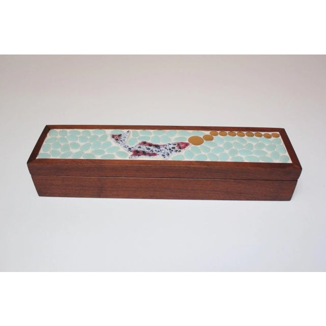 Decorative trinket/glove/jewelry box in walnut with hand-applied mosaic fish design. Attractive colors employed and...