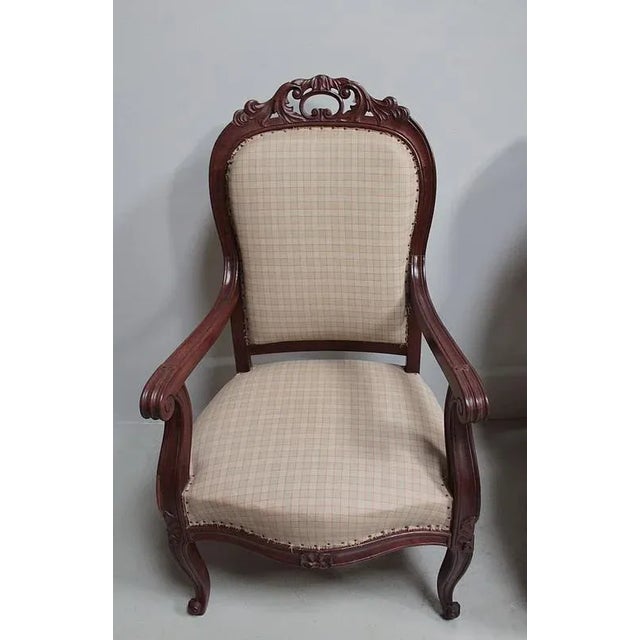 Suite 4 chairs Napoleon III mahogany. carved scrolls folder with "hand" at the top. They are based on two front legs...