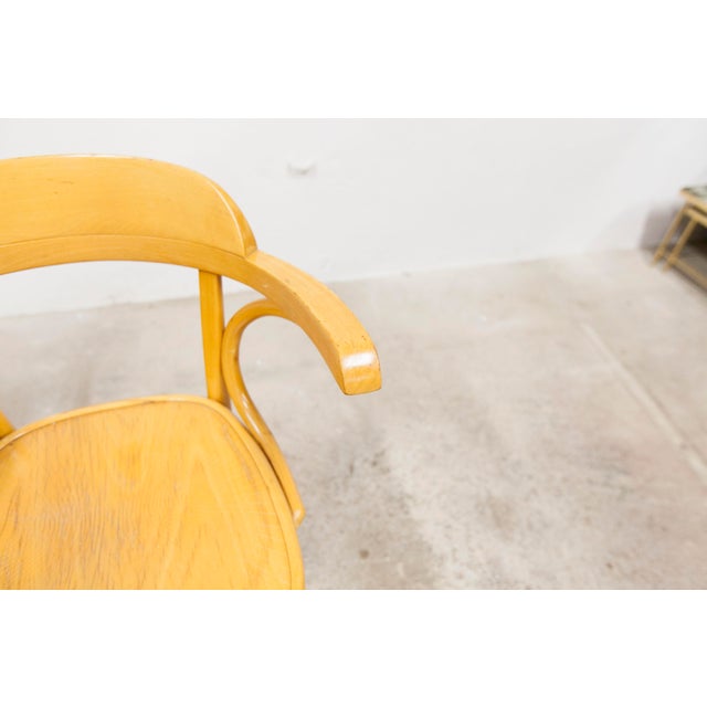 Set of 4 Scandinavian bistro-style armchairs from the 1960s. They have a golden honey color and are in superb condition....