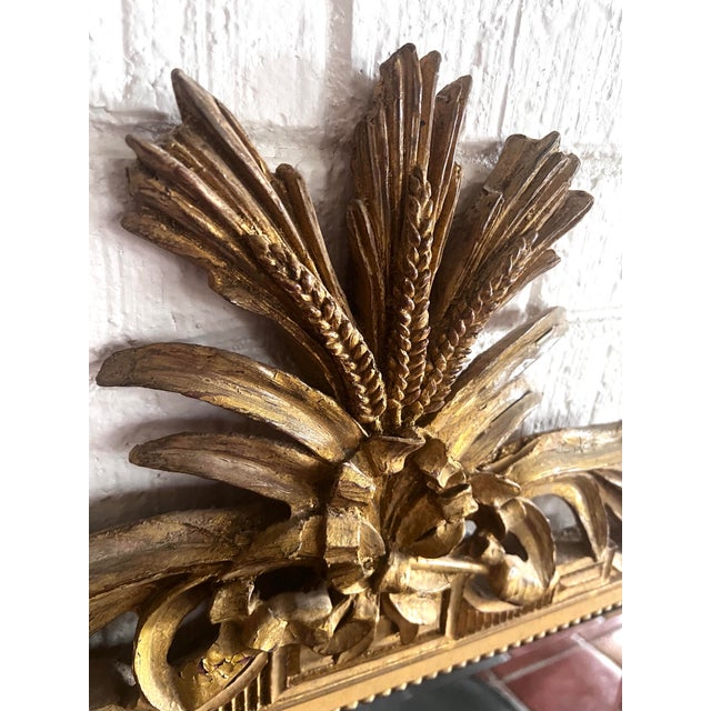 Early 20th Century French Carved Giltwood Beveled Wall Mirror. I especially love the wheat and foliate motif crest. Wheat...