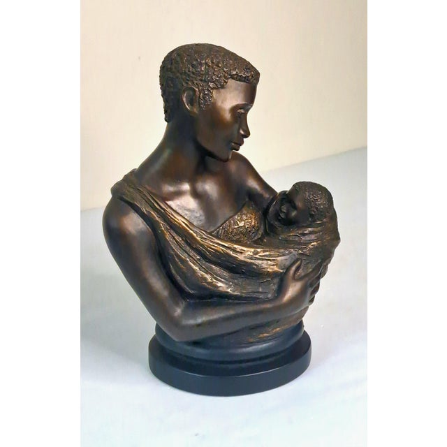A touching 1997 figurative sculpture titled Treasured Moments, designed by American artist Alice Heath Riordan for Austin...