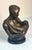 A touching 1997 figurative sculpture titled Treasured Moments, designed by American artist Alice Heath Riordan for Austin...