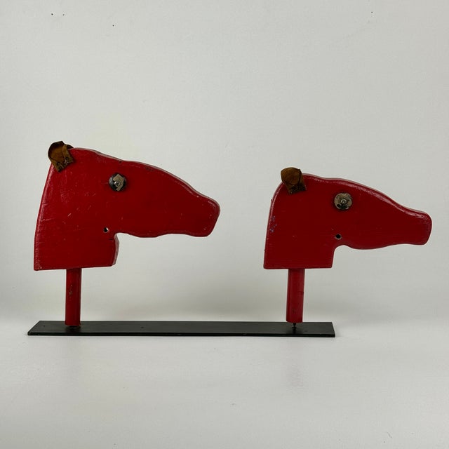 A fun double vintage wooden head busts of horses in red paint and leather ears turned sculpture. These have been cut off...