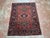 Antique Persian Karajeh rug, hand-knotted in Iran from 100% wool. Measuring 4’8” x 5’11”, the rug features a traditional...