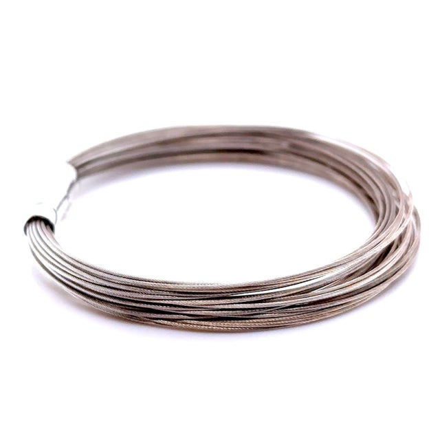 A distinctive vintage Tiffany & Co. multi-wire strand bracelet crafted in sterling silver, featuring multiple slender...